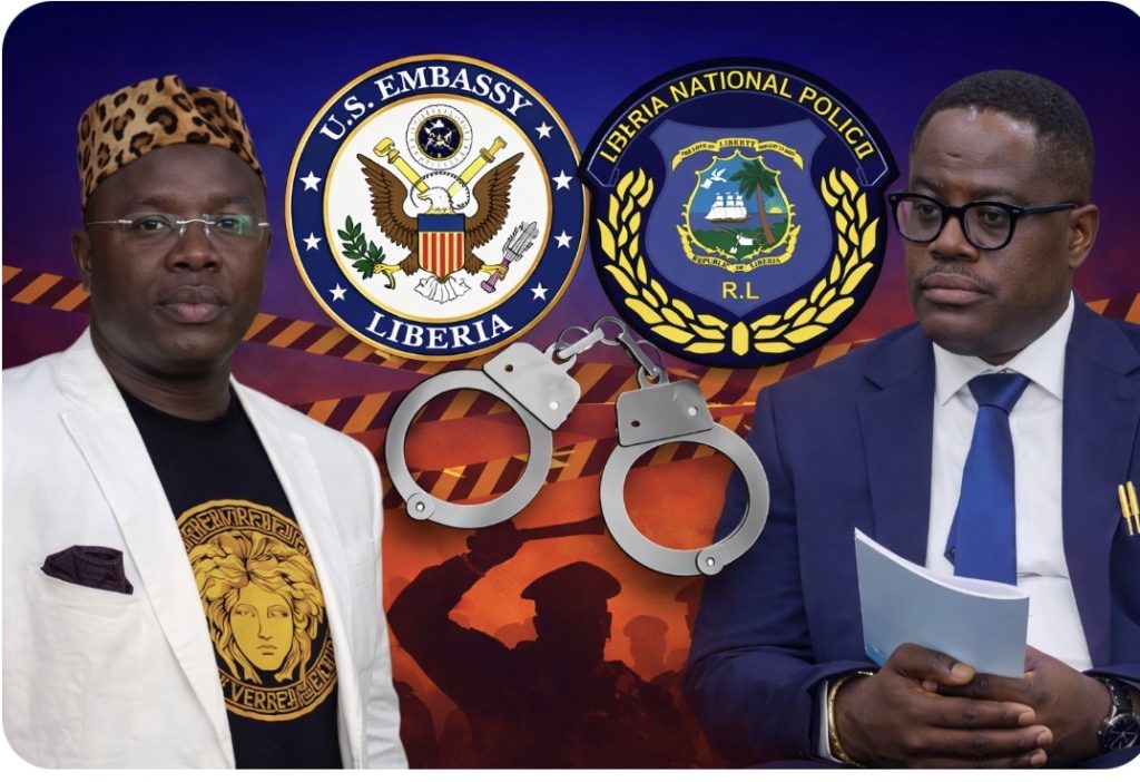 Two men in formal attire stand beside Liberia police emblems with a pair of handcuffs between them.